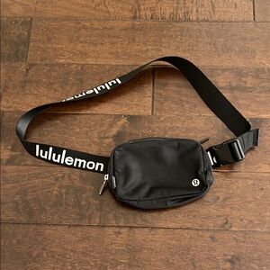 lululemon everywhere Black Crossbody Bag with black and white lululemon on strap